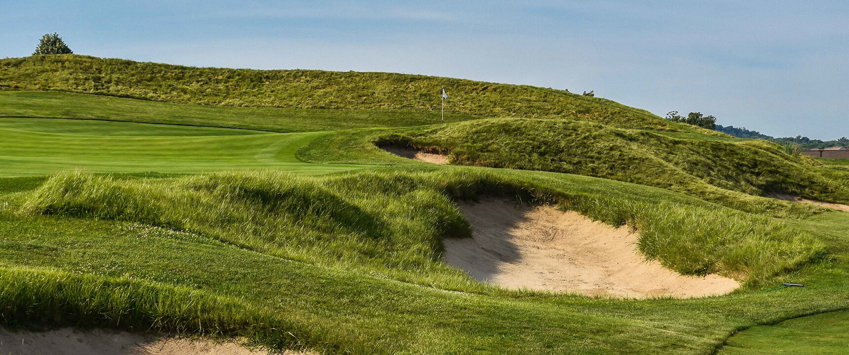 course green with bunkers and ridge