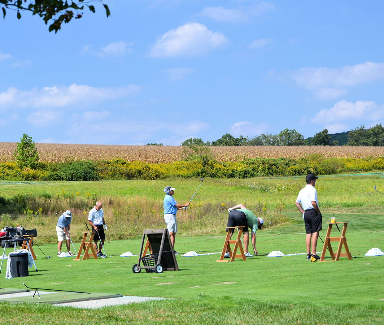 golfers at the driving range