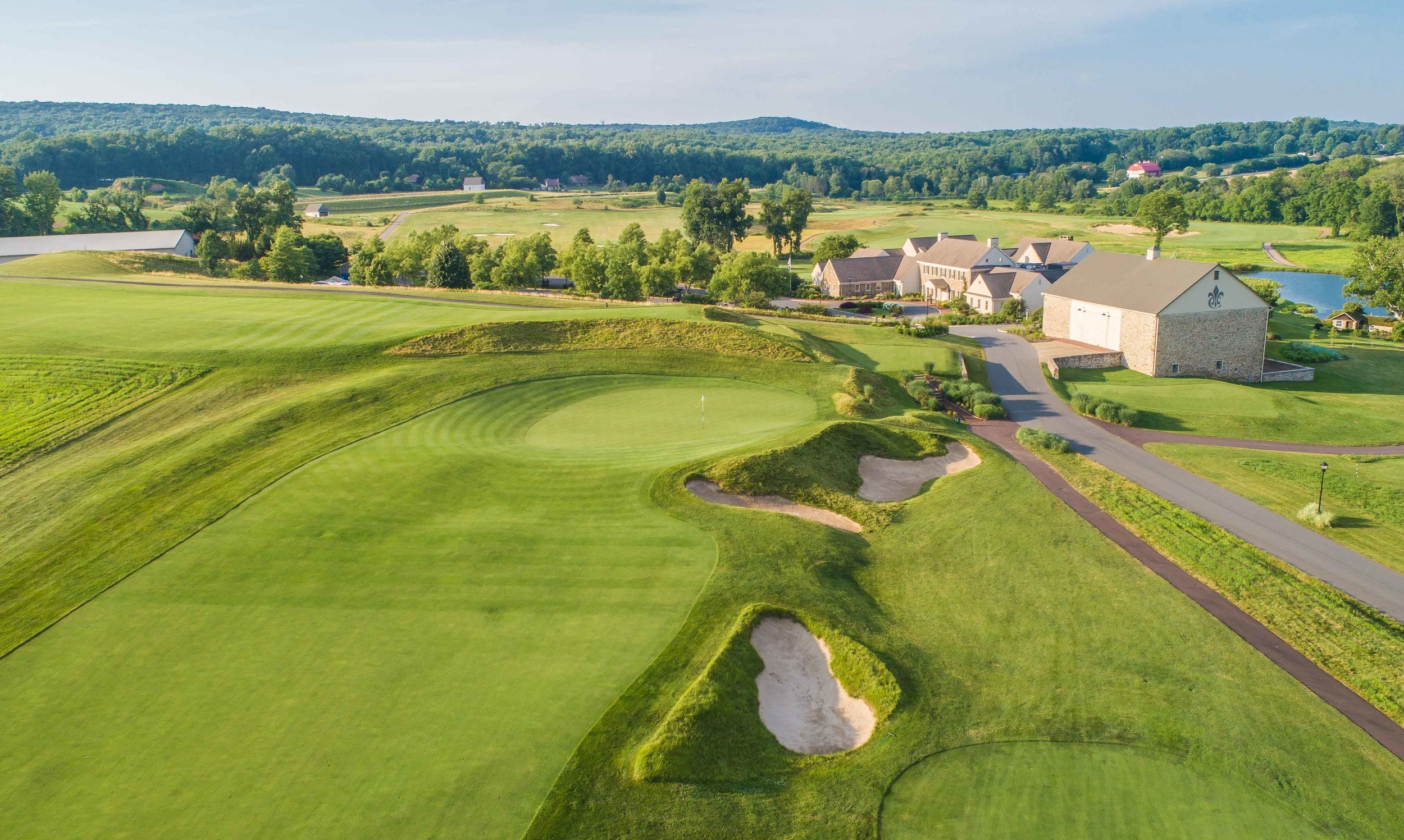 aerial view of clubhouse with ridge in the background